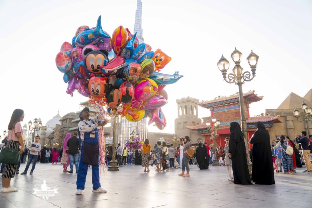 A Guy selling balloons in Global Village